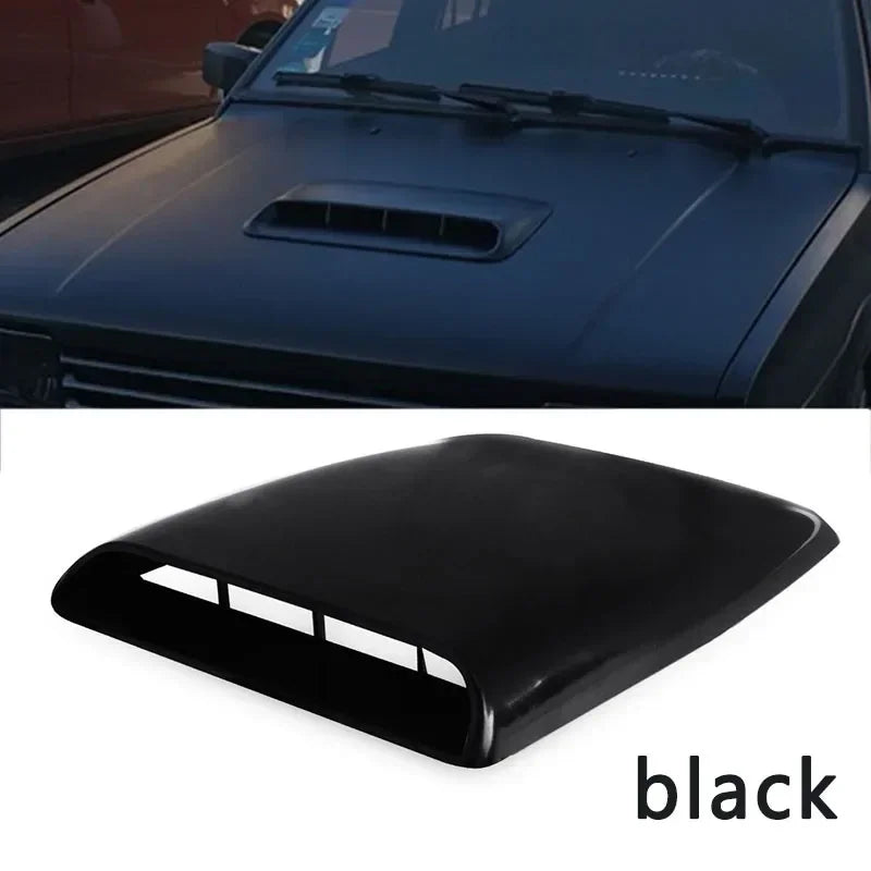 Black universal bonnet scoop fitted to a dark bonnet