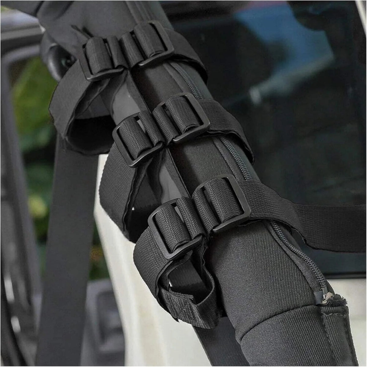 Roll bar holder strap wrapped around a 4WD sports bar