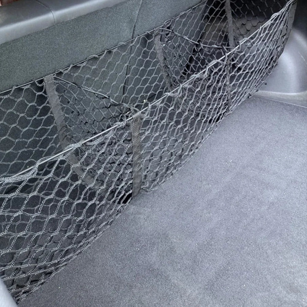3 pocket stretch cargo net fitted across the rear of a cargo area