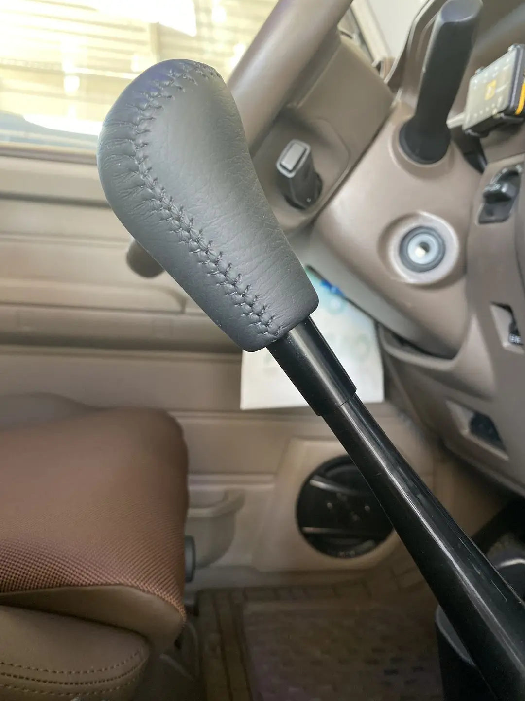 Gear shift extension fitted between lever and knob