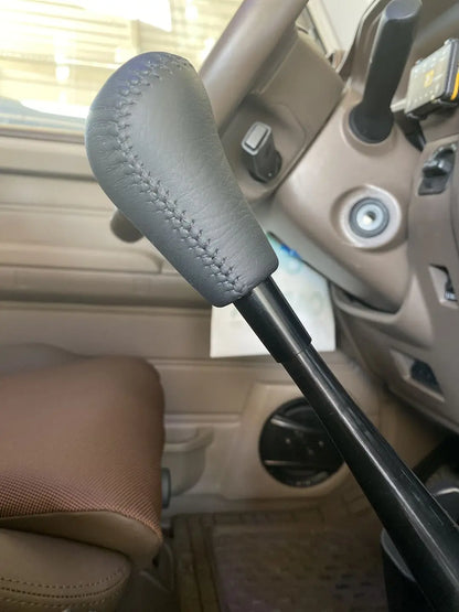 Gear shift extension fitted between lever and knob