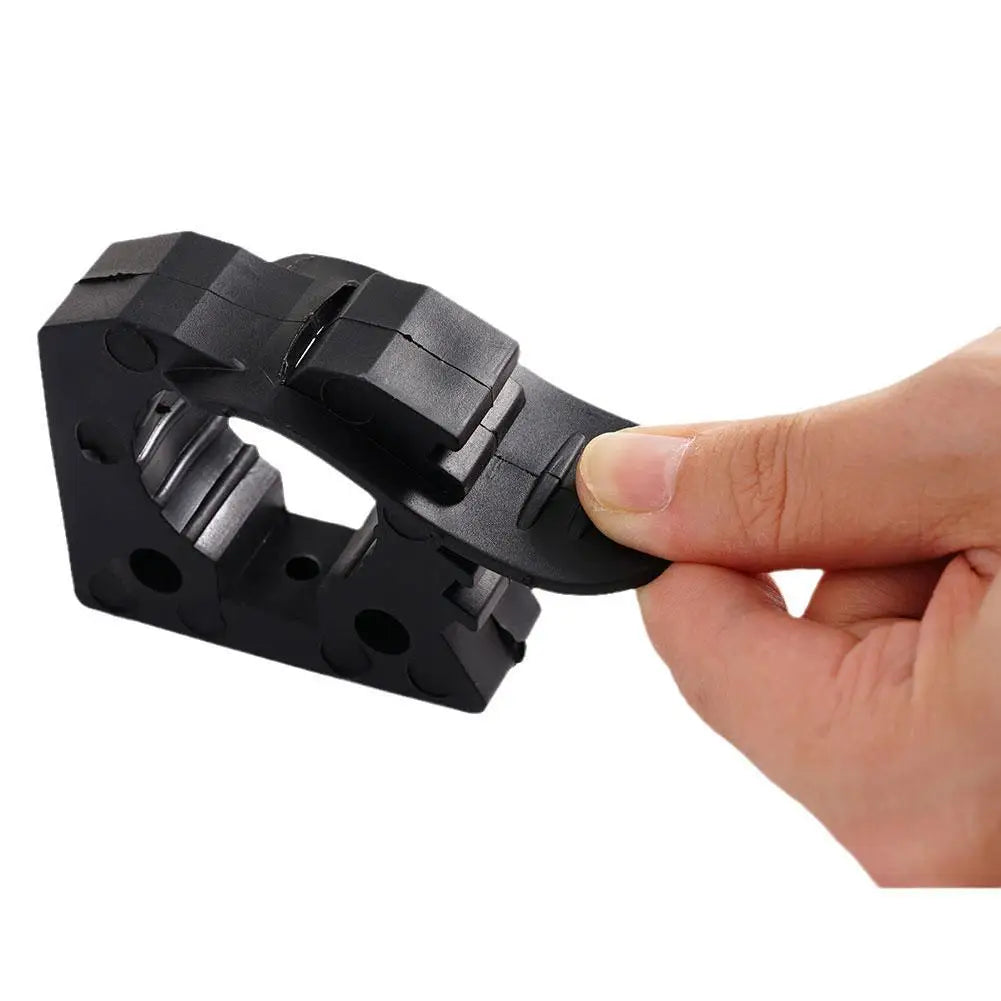 Pulling the rubber strap to release the tool clamp