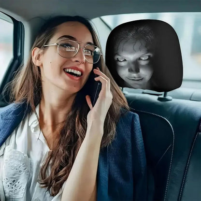 Spooky face headrest cover next to a back seat passenger