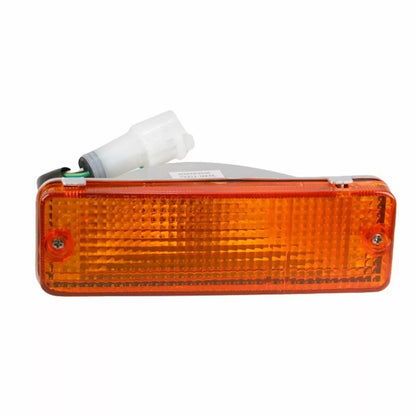 Front view of single amber bumper indicator light for 1988-1997 Hilux