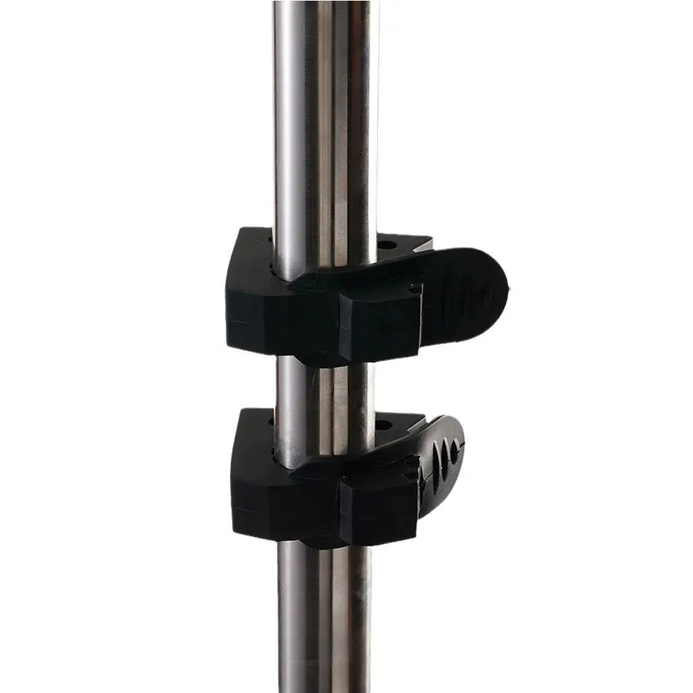 Pair of rubber clamps holding a vertical pole
