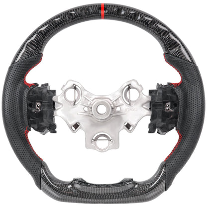 Perforated leather grip detail on carbon fibre steering wheel