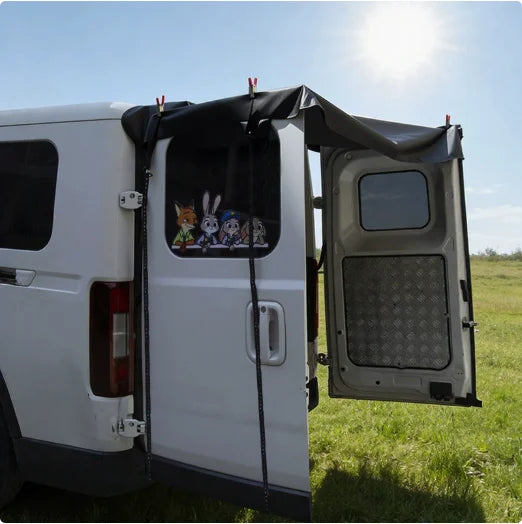 Rear barn door awning fitted across the open back doors of a van