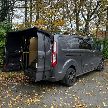 Side view of van with rear barn door awning fitted