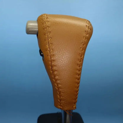 Leather shift boot fitted around gear lever base