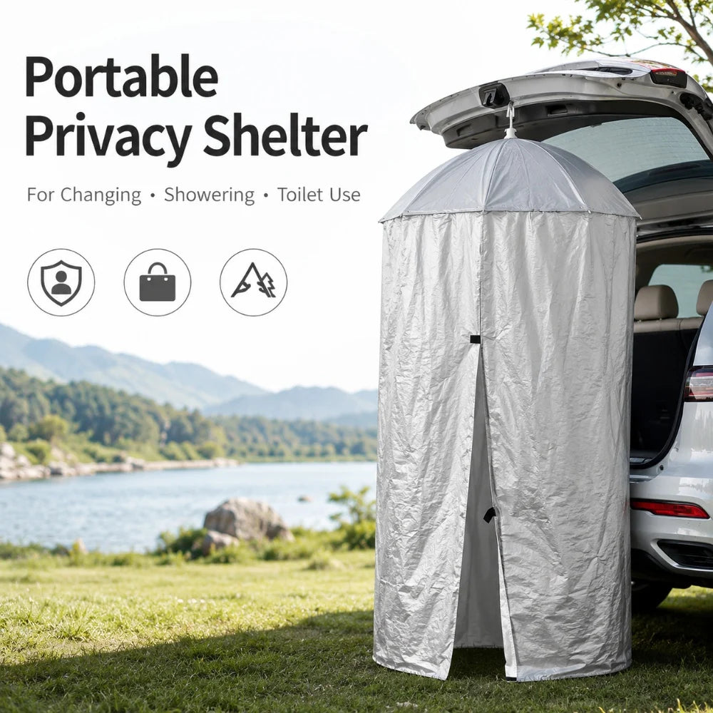 Silver pop-up privacy shower tent hanging from an SUV tailgate at camp