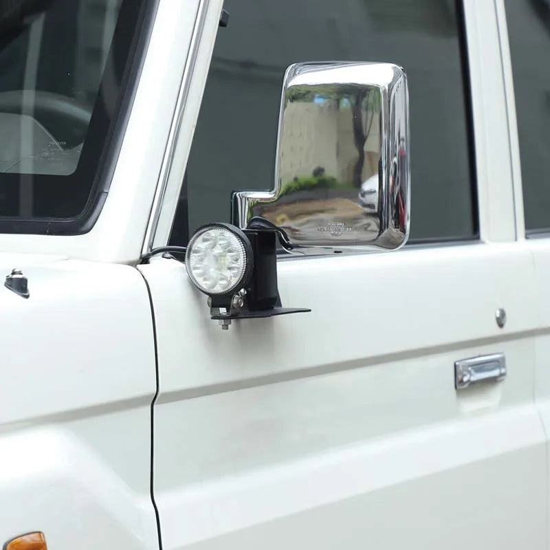 Work light mounted on mirror bracket on LandCruiser 70 Series