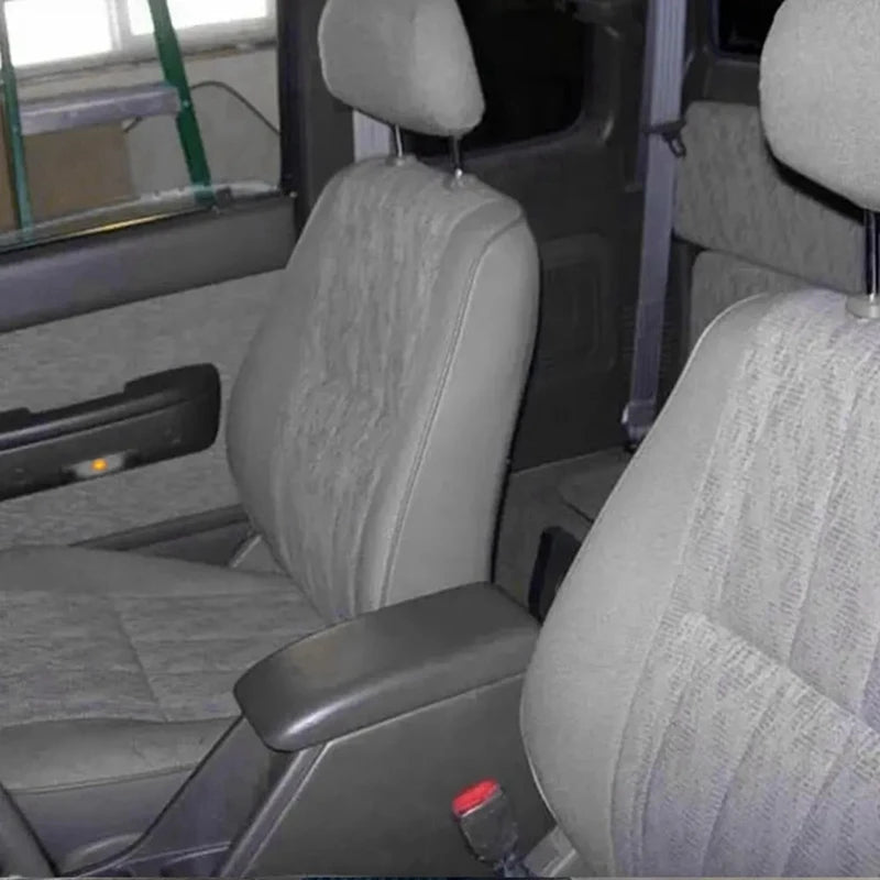 Console armrest lid fitted between the front seats of a Hilux Surf