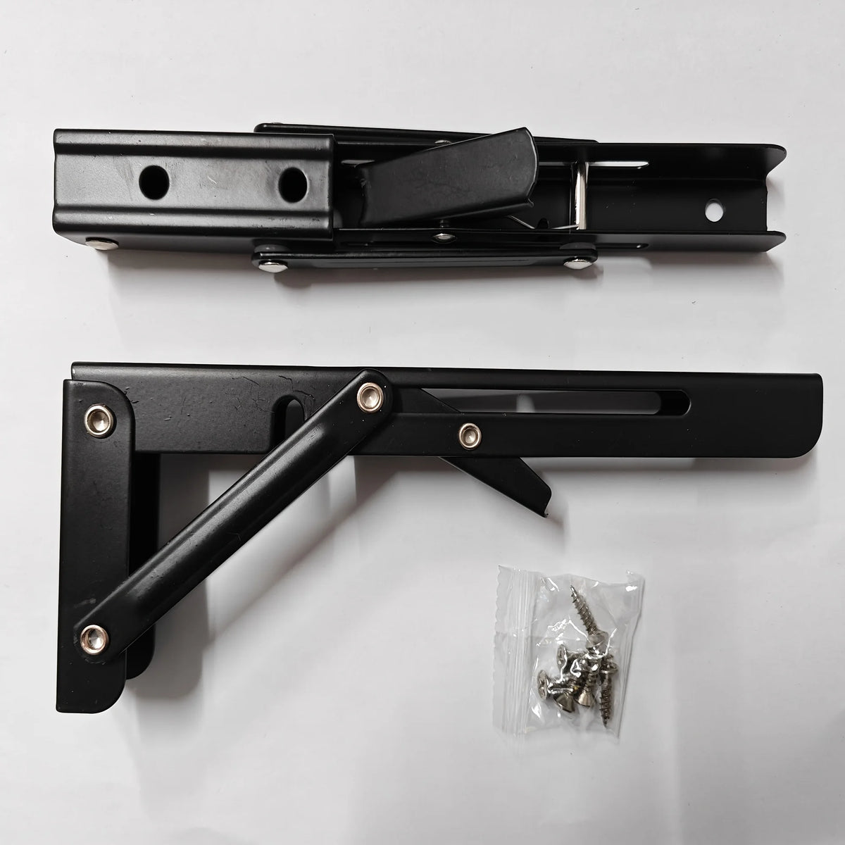 Folding shelf bracket shown open and folded with mounting screws