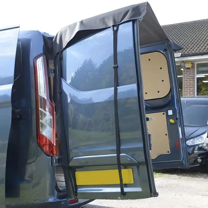 Barn door awning fitted to a grey van at the campsite