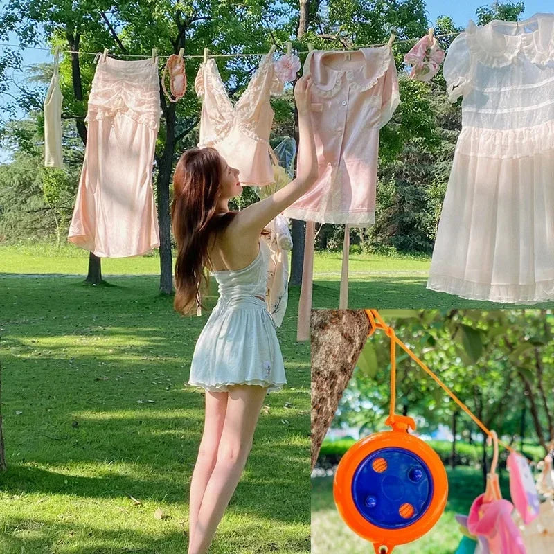Portable washing line strung between trees with clothes drying