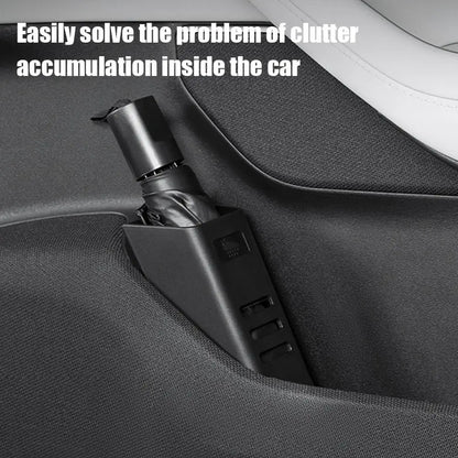 Folding umbrella stored upright in the boot holder