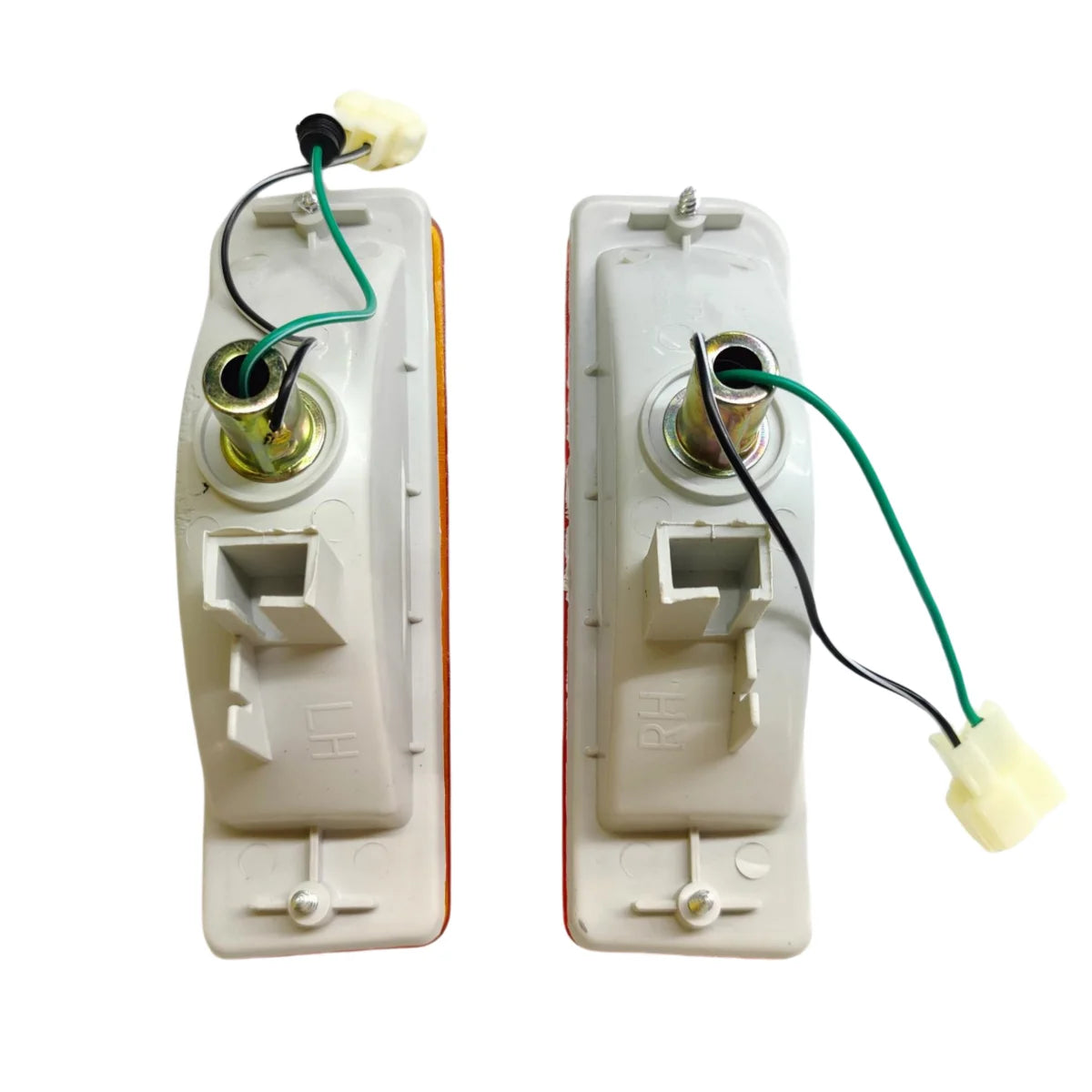 Rear of Hilux front corner indicator lights showing bulb sockets and wiring plugs