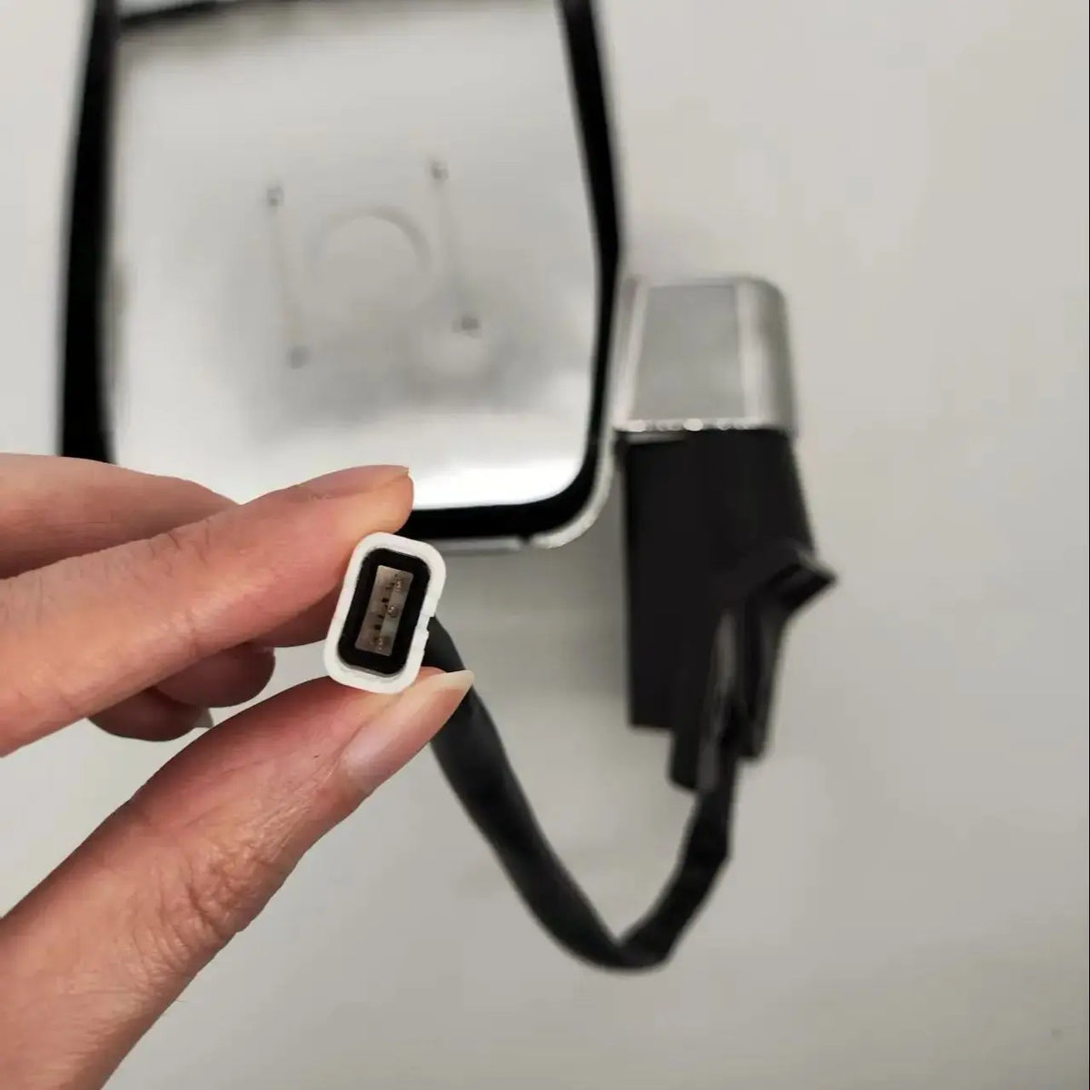 Electric mirror wiring plug close up