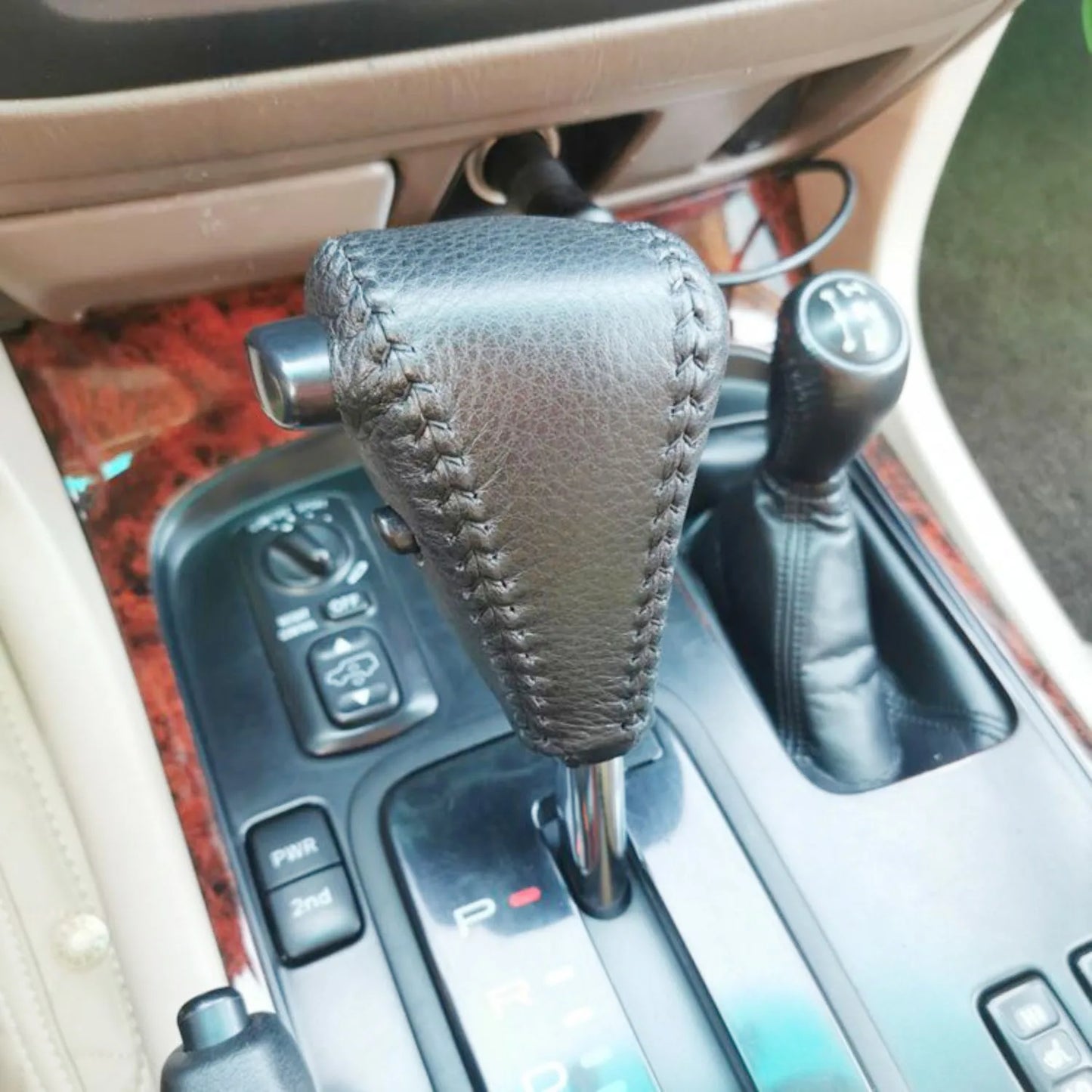 Grey leather gear knob cover fitted to shifter