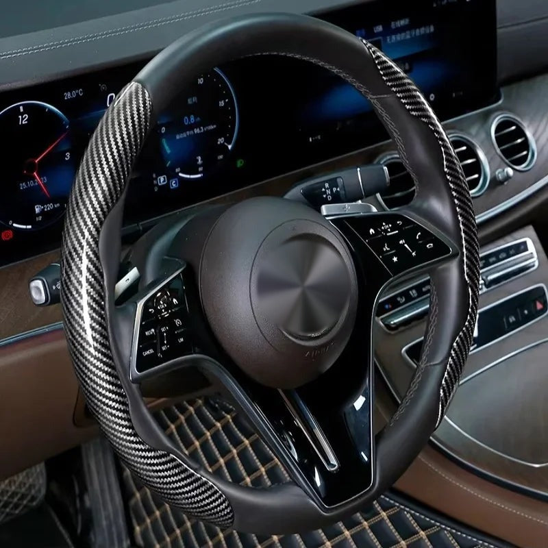 Black and silver carbon-look steering wheel grip covers fitted