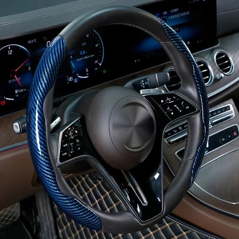 Blue carbon-look steering wheel grip covers fitted