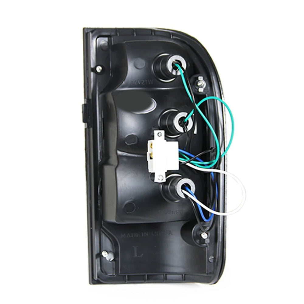 Back of aftermarket tail light housing showing bulb sockets and wiring plug, suits 1997-2004 Hilux