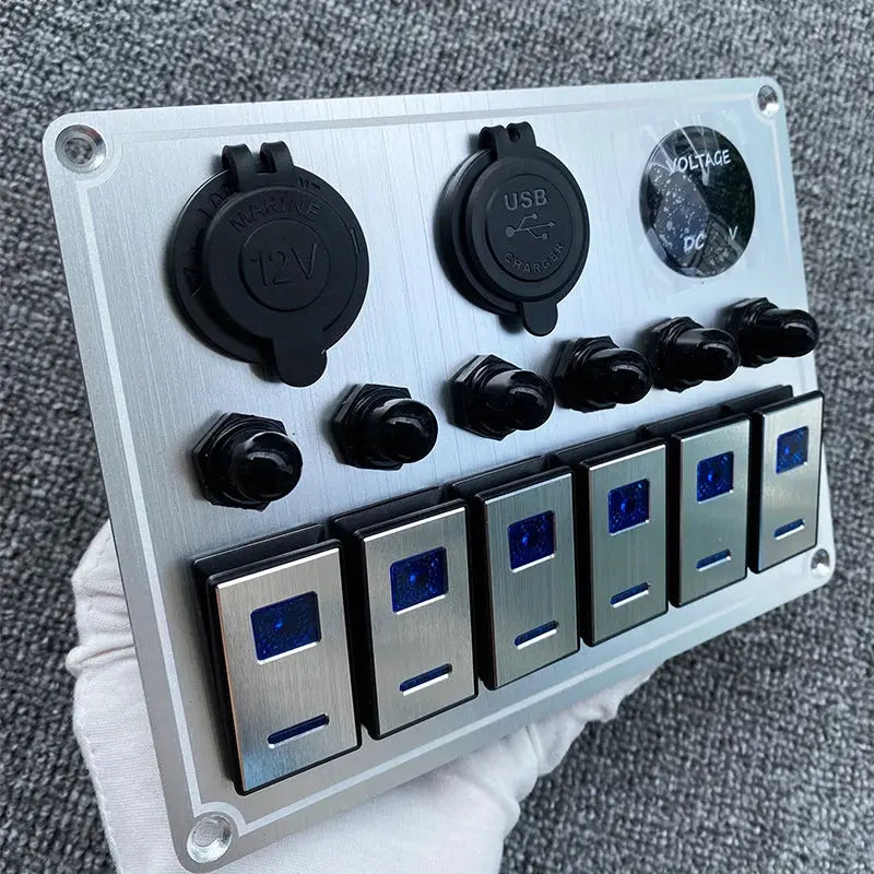 Overload protector buttons on the marine panel